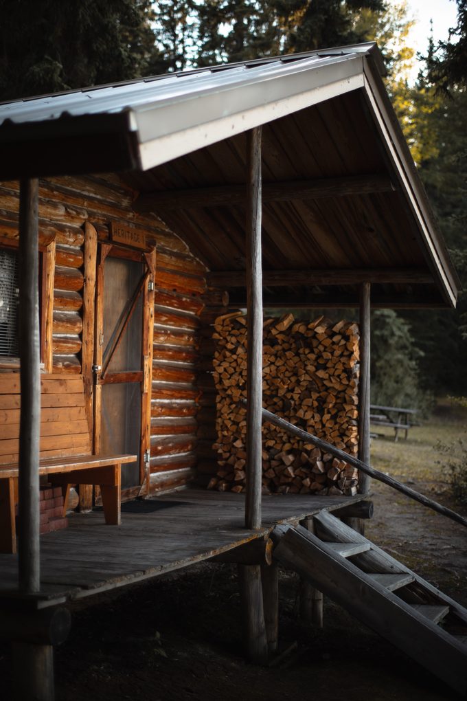 The porch and the woodpile at Eagle's Nest Resort.