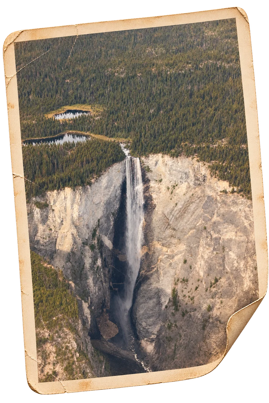 Hunlen Falls seen from the air, a single long
               drop off a forested plateau into the canyon below, as a weathered print.